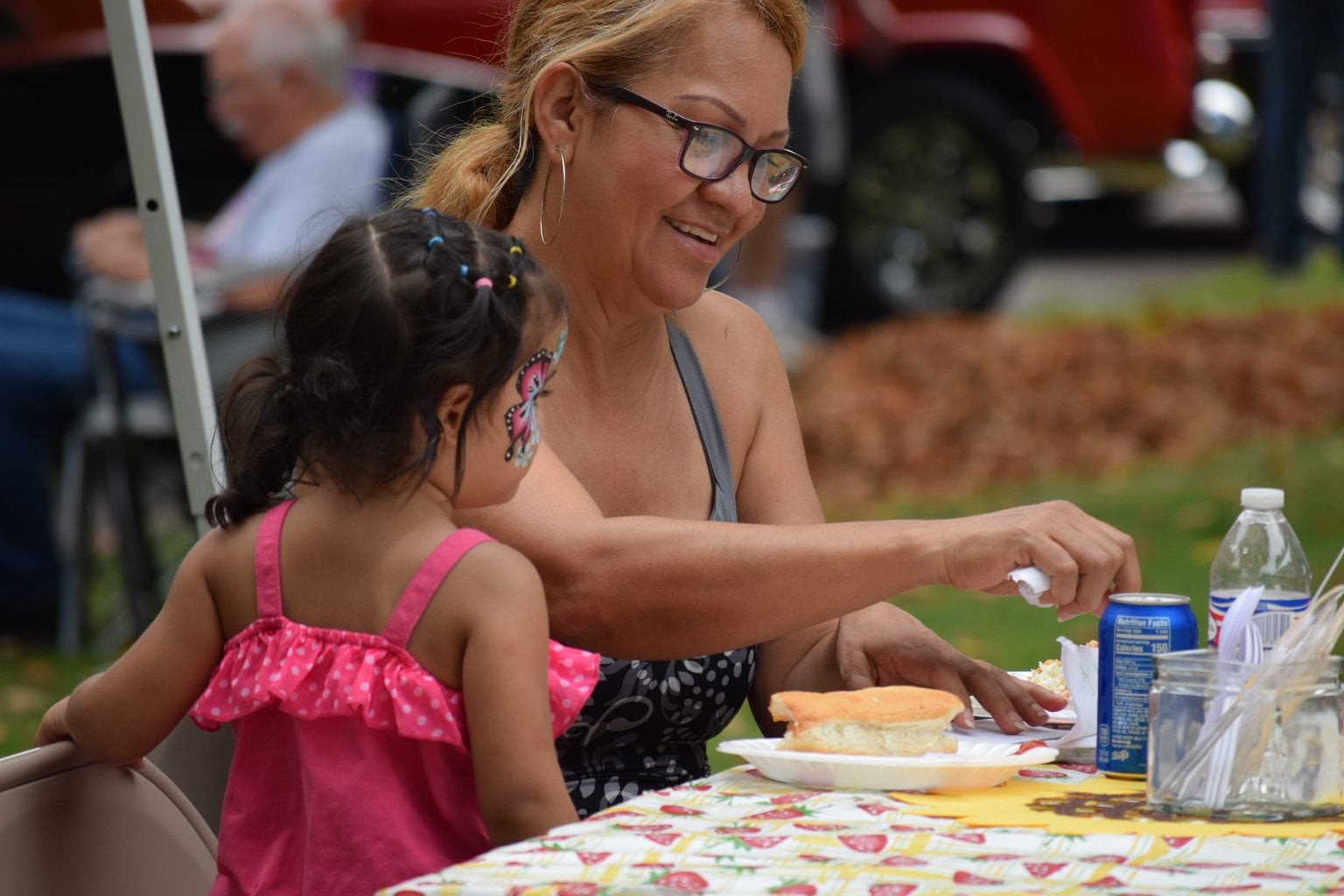 Woman and young girl enjoying an afternoon at the annual Sunflower Fair in downtown La Porte