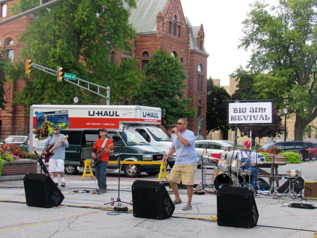 Festival crowds and vendor tents near the historic La Porte County Courthouse in downtown La Porte